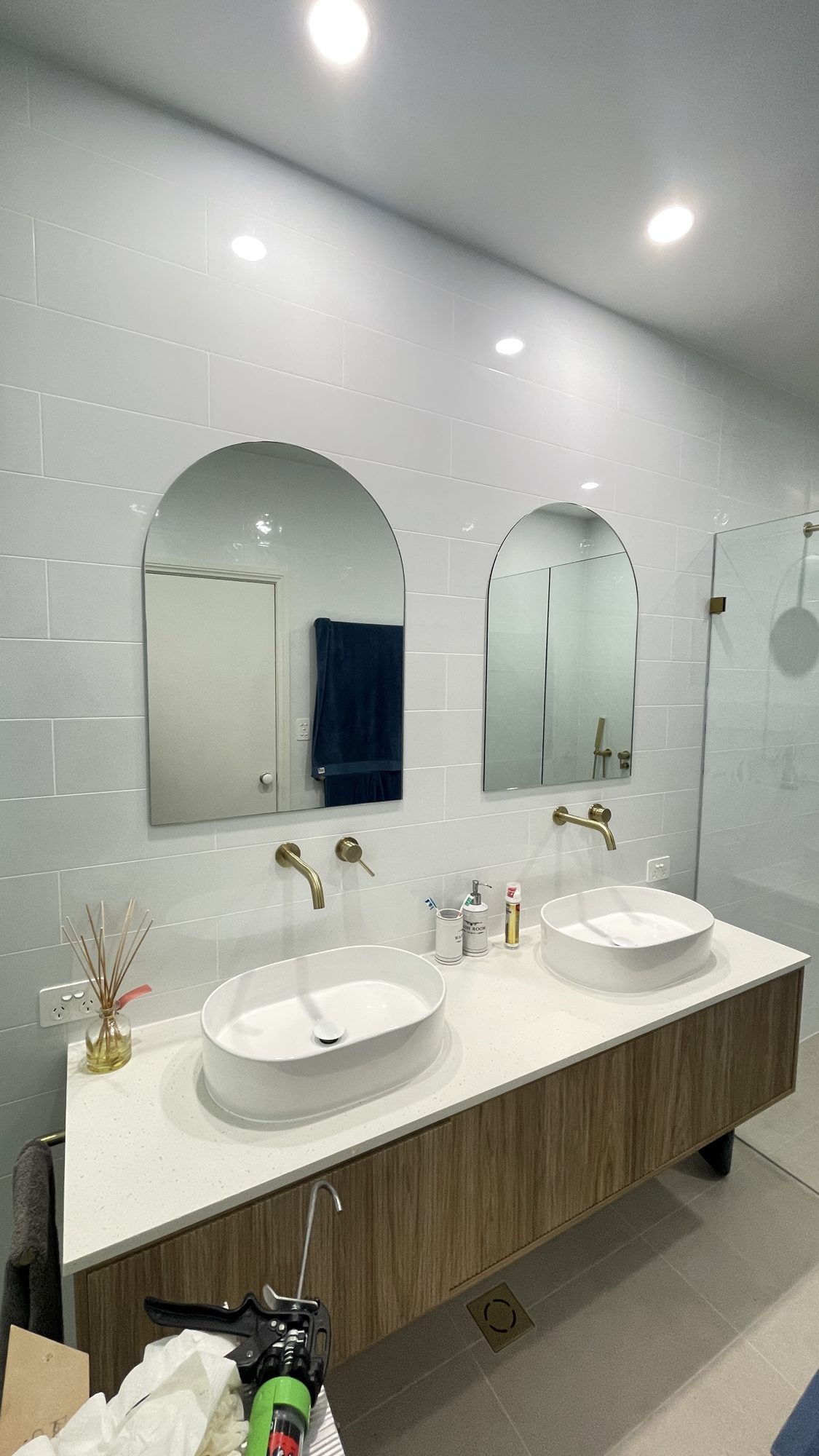 Arched custom mirrors over a double vanity by Unique Glass Solutions, Adelaide