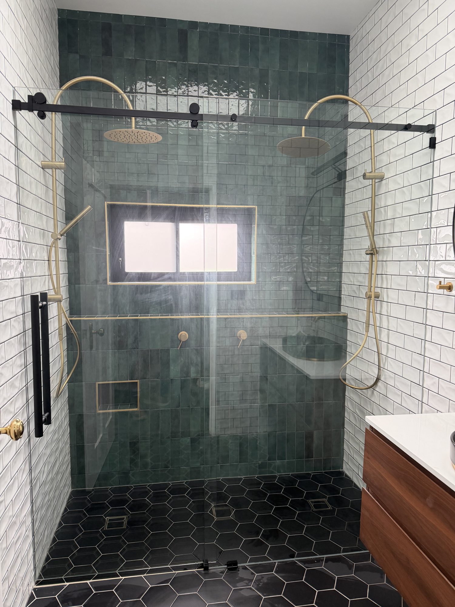 Matt black sliding screen, twin showers with brushed brass tapware — Adelaide, Unique Glass Solutions
