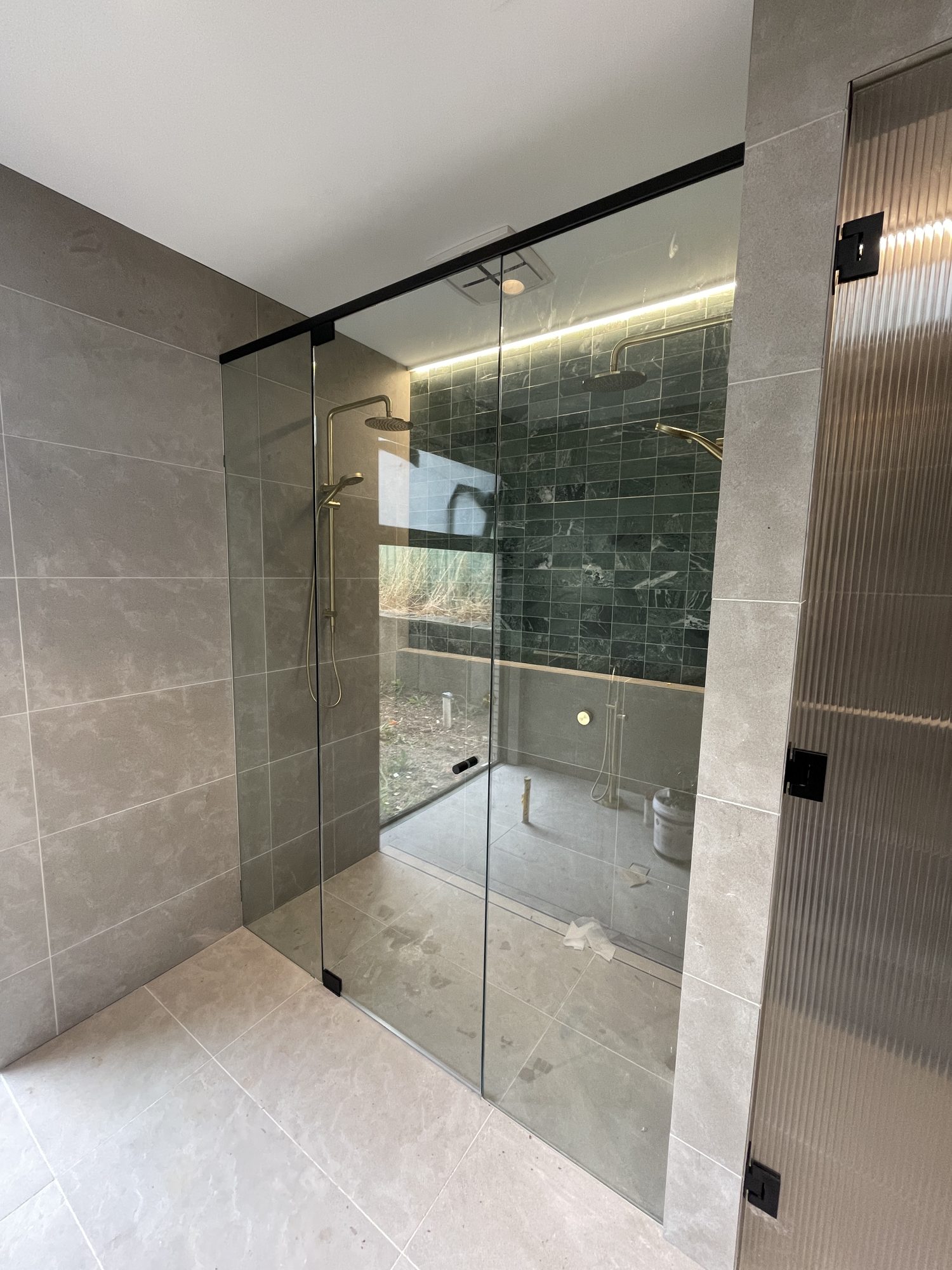 Green tile brass ensuite — Adelaide, Unique Glass Solutions