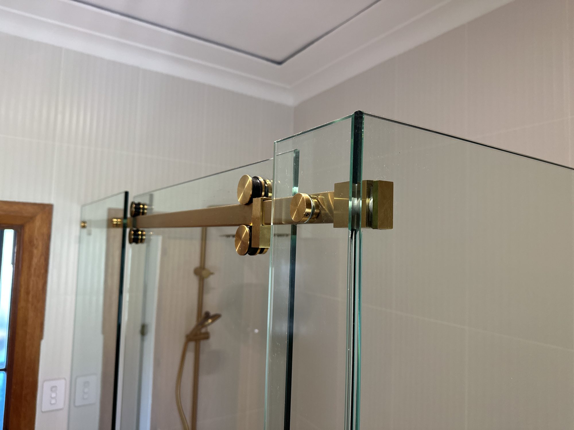 Gold slider roller detail — Adelaide, Unique Glass Solutions