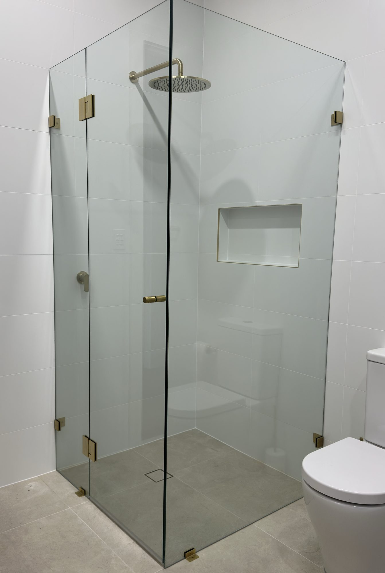 Satin gold frameless corner — Adelaide, Unique Glass Solutions