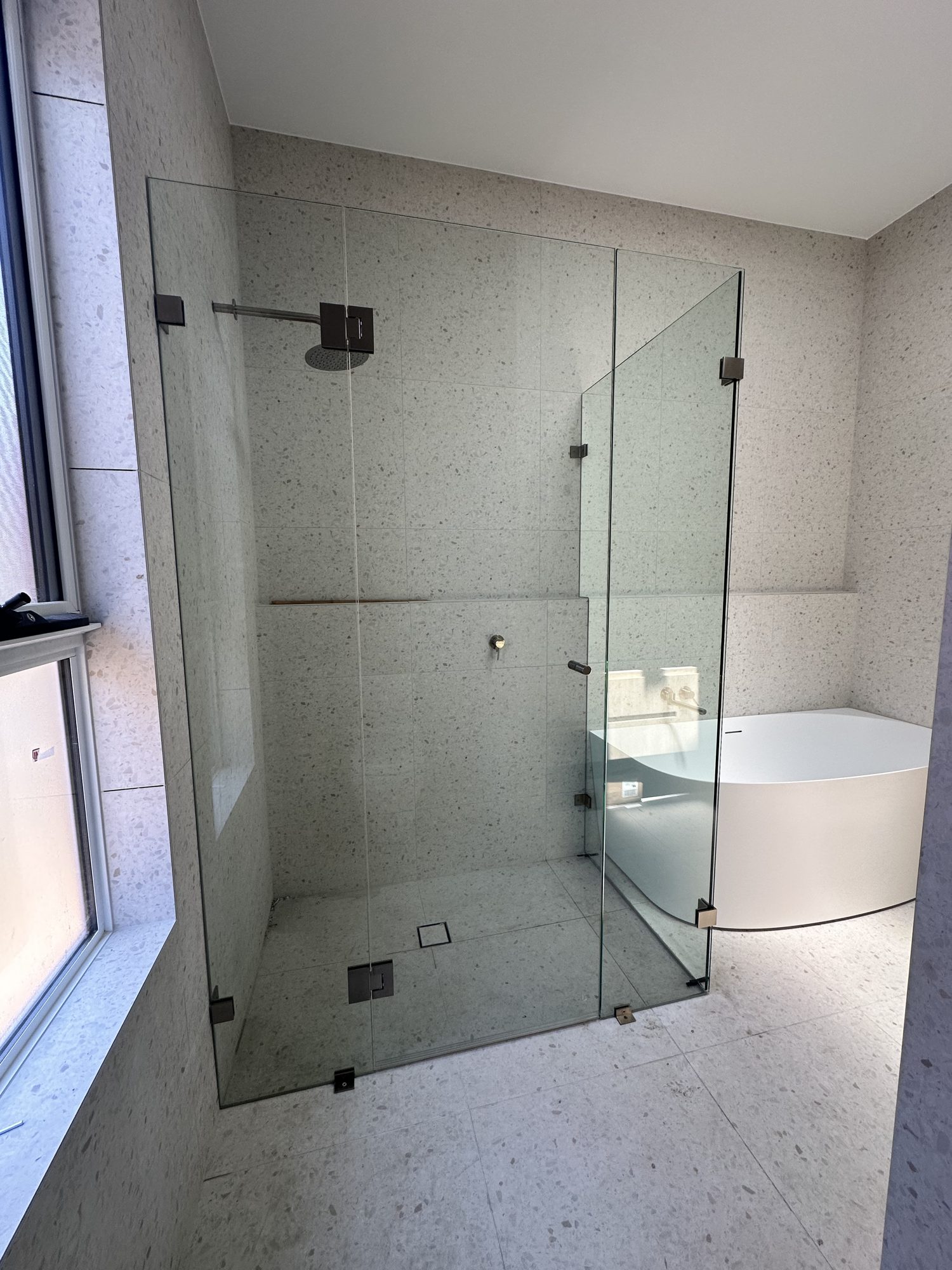 Frameless corner bath window — Adelaide, Unique Glass Solutions