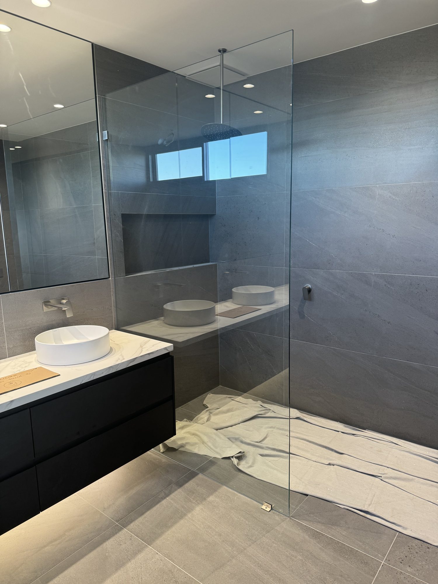Frameless panel dark ensuite — Adelaide, Unique Glass Solutions