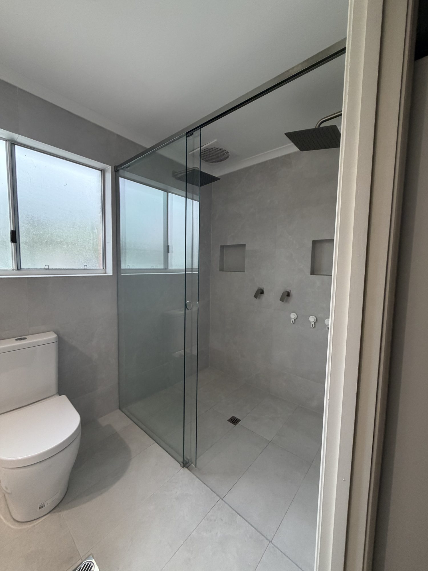 Frameless sliding shower screen, grey tile ensuite, Adelaide